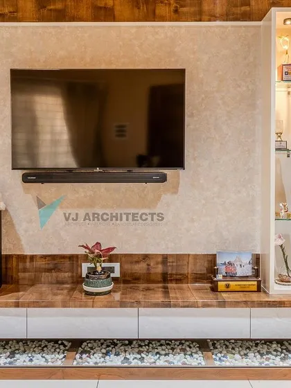 A well-designed TV unit combines media storage with display opportunities. This floating console features a mix of wood and white laminate, with an integrated display cabinet and a bed of white pebbles below for a touch of organic texture.