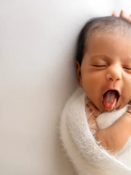 Another adorable yawn! These moments are too precious not to capture. It shows the real, unposed side of newborn life.