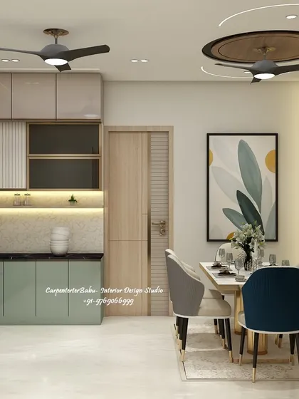 An open-plan kitchen and dining area where the color palette of sage green and light wood creates a fresh and modern feel.