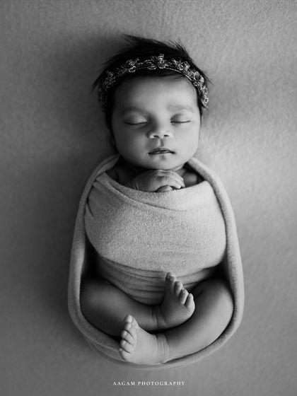 The same pose in black and white, highlighting the perfect form and serene mood of the portrait.