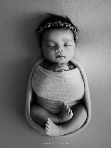 The same pose in black and white, highlighting the perfect form and serene mood of the portrait.