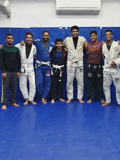Standing with some of my students. As a coach, my goal is to guide them in understanding not just the moves, but the concepts and feelings that make Jiu-Jitsu a lifelong practice.