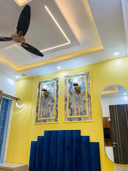 A final look at the master bedroom's feature wall, combining bold colors and textures for a royal feel.