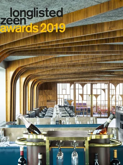 We are proud that our Queensline Sea Yah project was longlisted for the prestigious Dezeen Awards in 2019. This image shows the main dining area, where brass inlays and custom lighting complement the teak wood paneling, reflecting our commitment to material richness and detailed execution.