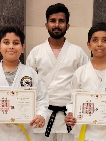 Moving up the ranks to the yellow belt. These students have demonstrated a solid understanding of karate fundamentals, and I am proud to present them with their well-earned certificates.