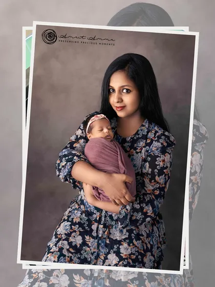 A beautiful, classic portrait of a mother and her sleeping newborn. The floral dress complements the soft, gentle mood of the image.