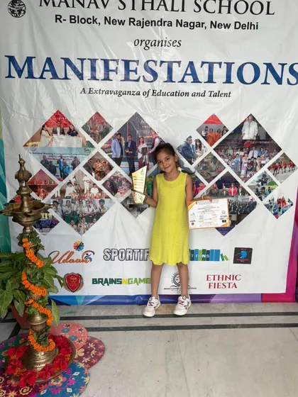 Qiana Jain proudly holds her trophy and certificate after securing the 3rd position in the U-7 girls' category. Her determination during the tournament was an inspiration to watch.