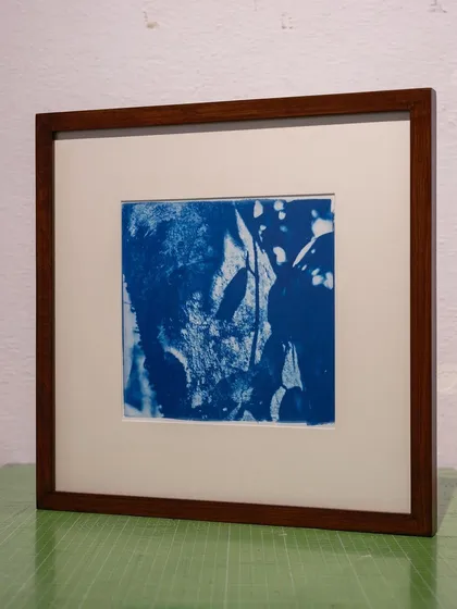 A framed abstract cyanotype with deep, rich blues. Each commissioned piece is a unique work of art, handcrafted in our studio.
