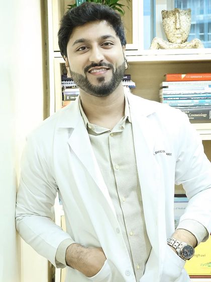 Dressed in my coat at the clinic. Whether you're looking for acne treatments, laser hair removal, or anti-aging solutions, I have the courage and expertise to help you pursue your skin goals.