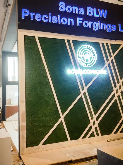 I help brands stand out by integrating natural elements into their corporate presence. For this Sona BLW stall, I designed and installed a custom green wall with geometric patterns that incorporated their illuminated logo, creating a modern and memorable brand statement.