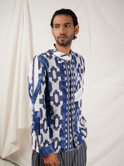 A three-quarter shot that provides a clear view of the kurta's unique pattern and fit. The model's relaxed pose makes the outfit feel both stylish and wearable.