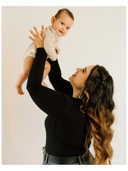 The pure joy in a mother's eyes as she lifts her baby into the air is a moment worth freezing in time. These are the simple, loving interactions I aim to capture in my parent and child sessions.