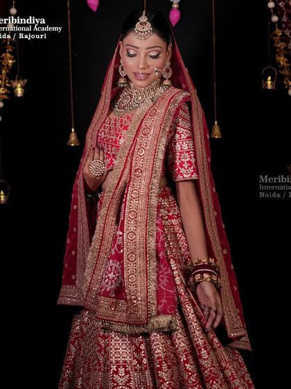 A full view of our Diwali-inspired bridal creation. The rich red lehenga and golden jewelry are perfect for the festival of lights.