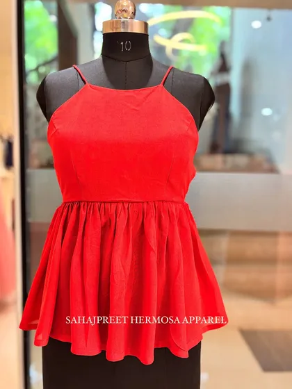 The same PEECHA kurti design in a vibrant, eye-catching red. All our pieces are made-to-order and can be customized in any color.