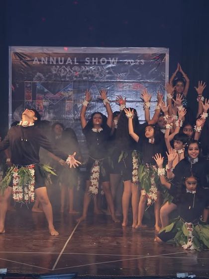 A dramatic final pose from our tribal act. We use formations and expressive postures to create memorable stage pictures.