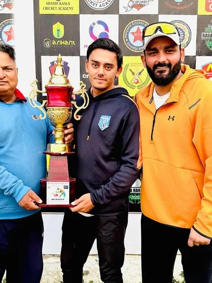 Another tournament win. Receiving the trophy for the 9th Bhagwan Parshuram Open Cricket Tournament.