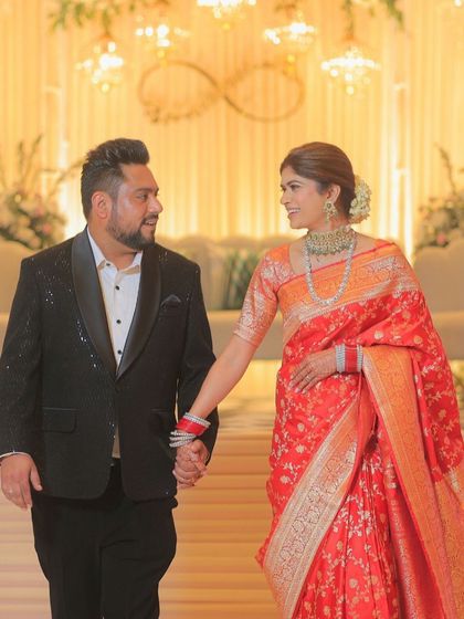A candid walking shot of the couple. The bride's makeup is flawless and long-lasting, ensuring she looks perfect throughout the event.