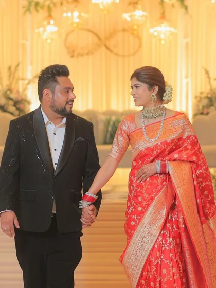 A candid walking shot of the couple. The bride's makeup is flawless and long-lasting, ensuring she looks perfect throughout the event.