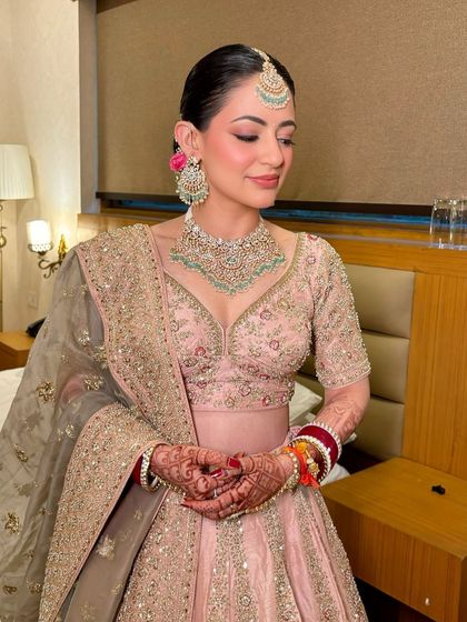 A close-up of the soft pink tones and the flawless, glowing skin. This look is perfect for a day wedding.