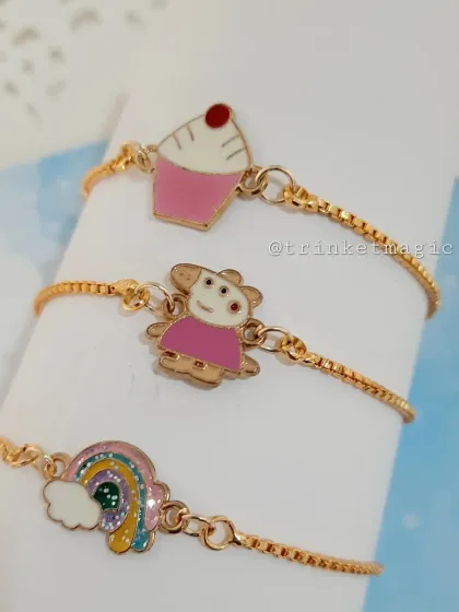 Perfect for little ones, these adjustable charm bracelets are all about fun. This set includes adorable Peppa Pig, cupcake, and rainbow enamel charms on a delicate gold-tone chain, making them great for party favors or festive gifts.