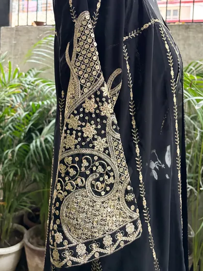 The sleeves of the jacket are heavily embroidered, making them a beautiful focal point.