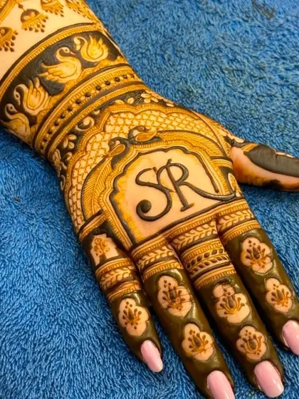 A close-up of the "SR" initial design, showing the clean lines and floral details.