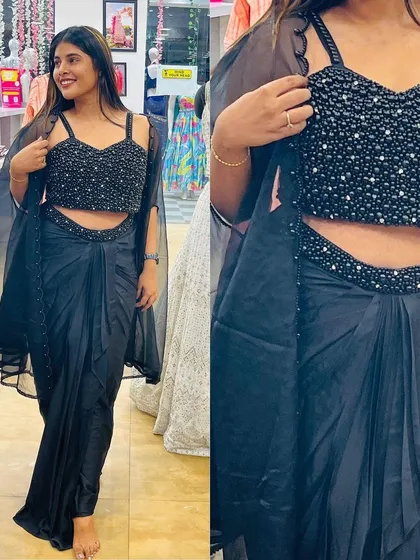 A classic black drape saree with a fully-sequenced blouse and a simple organza cape.