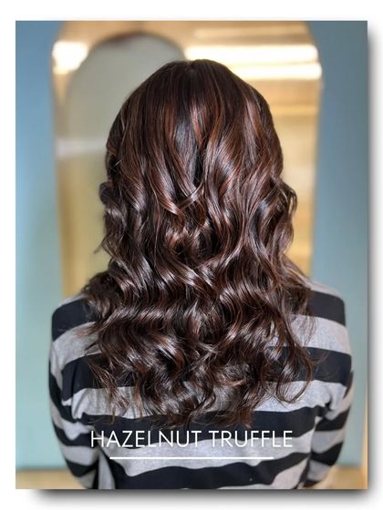 This 'Hazelnut Truffle' color is a deep, luxurious brunette with soft, warm undertones. It’s a classic choice that delivers incredible shine and a healthy, polished appearance.
