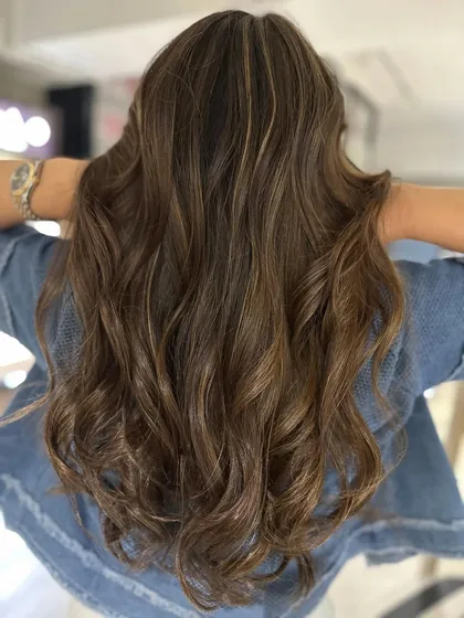 A complete hair color transformation using a classic highlight technique. The result is fresh, vibrant, and full of life.