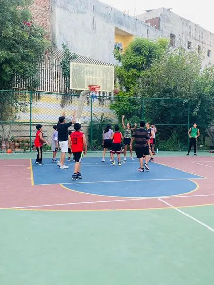A player takes a jump shot during an evening practice.