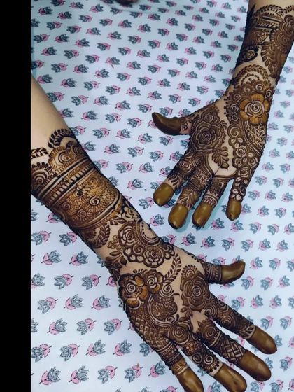 A collection of photos showing the gorgeous results of my henna, from a lighter orange stain to a deep, rich maroon.