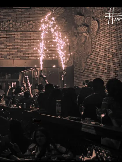 Cold sparks going off inside Hashtag Kolkata, adding to the celebratory atmosphere.