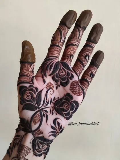A close-up of the bold rose design. The contrast between the dark, filled petals and the fine lines is what makes this style so unique.