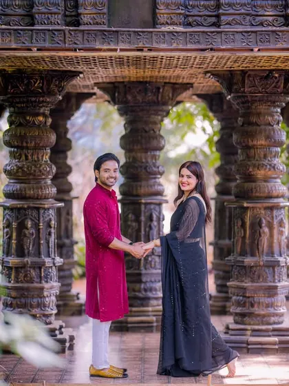 A beautiful shot of a couple in traditional attire within our stone pillar hall, a set that evokes the feeling of ancient temples.