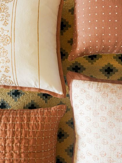 Our block printed cushions celebrate the beauty of handcrafted textiles. This collection features earthy, rust-colored fabrics with traditional Indian motifs, perfect for adding warmth and artisanal charm to your space.