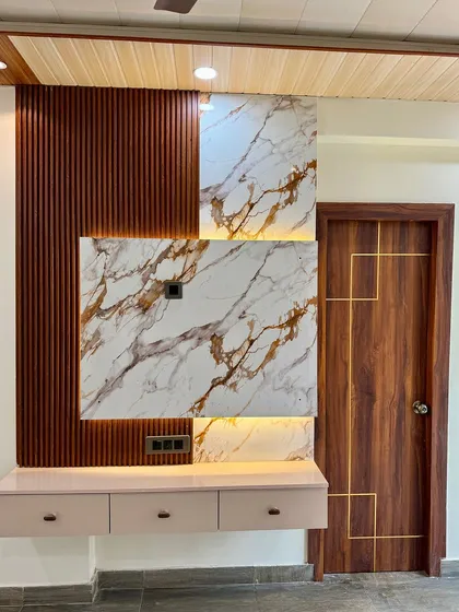 This TV cabinet combines a wood-fluted panel with a unique offset marble-finish back panel. The floating drawers add to the modern, clean look.