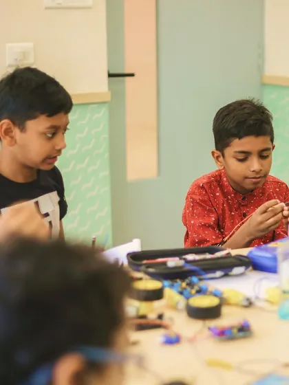 Another shot of Aethen and his friend working together, demonstrating the collaborative spirit we encourage in our robotics and STEM programs.