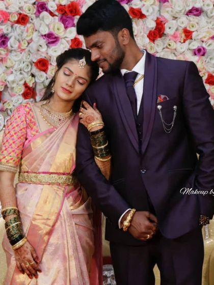 An intimate moment between the wedding couple. The bride's glowing makeup and traditional attire create a timeless and romantic image.