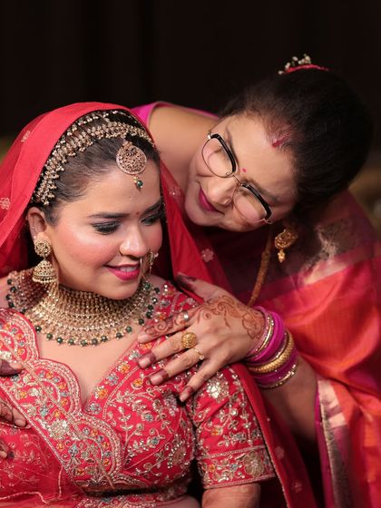 A heartwarming moment between the bride and her mother. The makeup is designed to be emotional-proof, staying flawless through all the happy tears.
