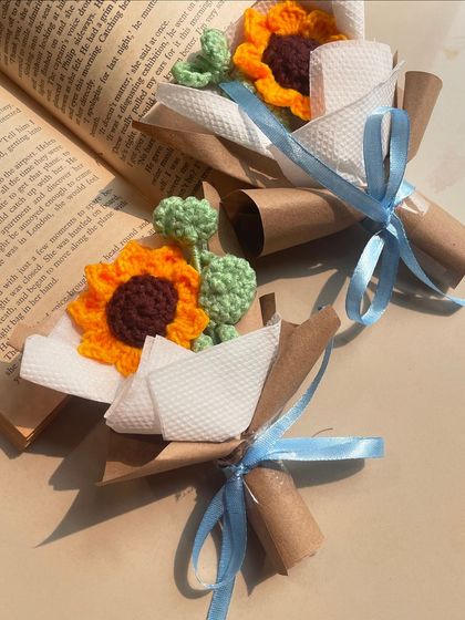 Two mini sunflower bouquets, ready to be gifted. They make perfect party favors or small tokens of appreciation.