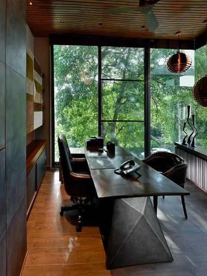 The view from behind the desk in the T House study. The design prioritizes the connection to nature, making the experience of working here one of inspiration and tranquility, as if floating within the trees.