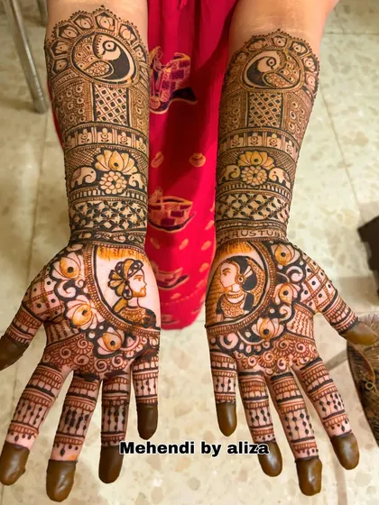 Another view of the bridal mehendi with portraits, showing the beautiful symmetry and detail.