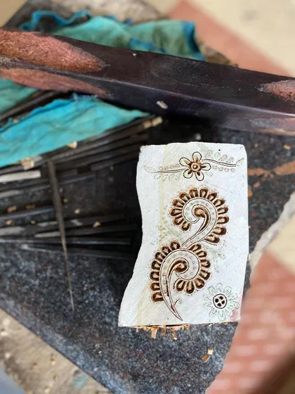 A close-up of a freshly carved block, ready for its first print. The crisp lines and intricate details showcase the precision and artistry that go into every single one of our custom and heritage designs.