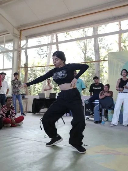 Another moment from the battles, with a dancer showcasing her unique style and flow.