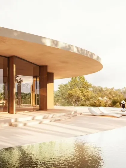 A view of the villa's terrace and pool, showcasing the clean, minimalist aesthetic that allows the natural surroundings to take center stage.