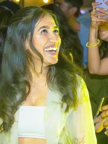 A guest laughing and enjoying the party.