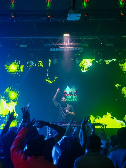 Me commanding the stage with a massive LED screen behind me. The visual production at Happy Brew is fantastic.