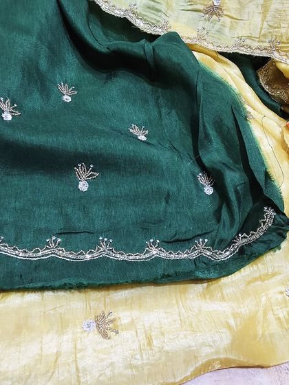A beautiful combination of green and yellow crush tissue sarees, both featuring delicate self-colored embroidery. These sarees are light, comfortable, and perfect for any celebration.