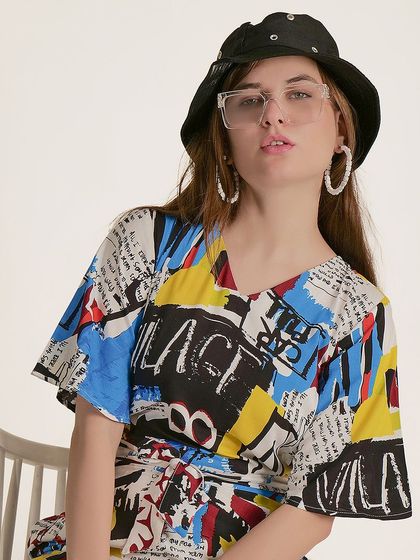 A close-up shot that allows customers to see the details of the unique print and the V-neck cut of the jumpsuit.