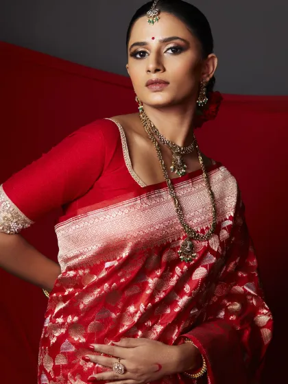 This portrait emphasizes the radiant, perfected skin and the harmony between the makeup and the rich textures of the Banarasi saree. The look is a testament to my belief in creating beauty that is both rooted in tradition and powerfully modern.